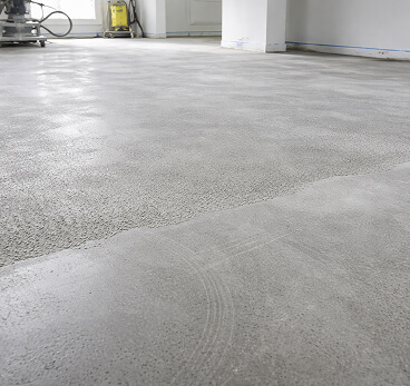 Grey concrete floor with radio grinding marks