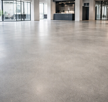 Seamless polished concrete floor in the lobby of an office building